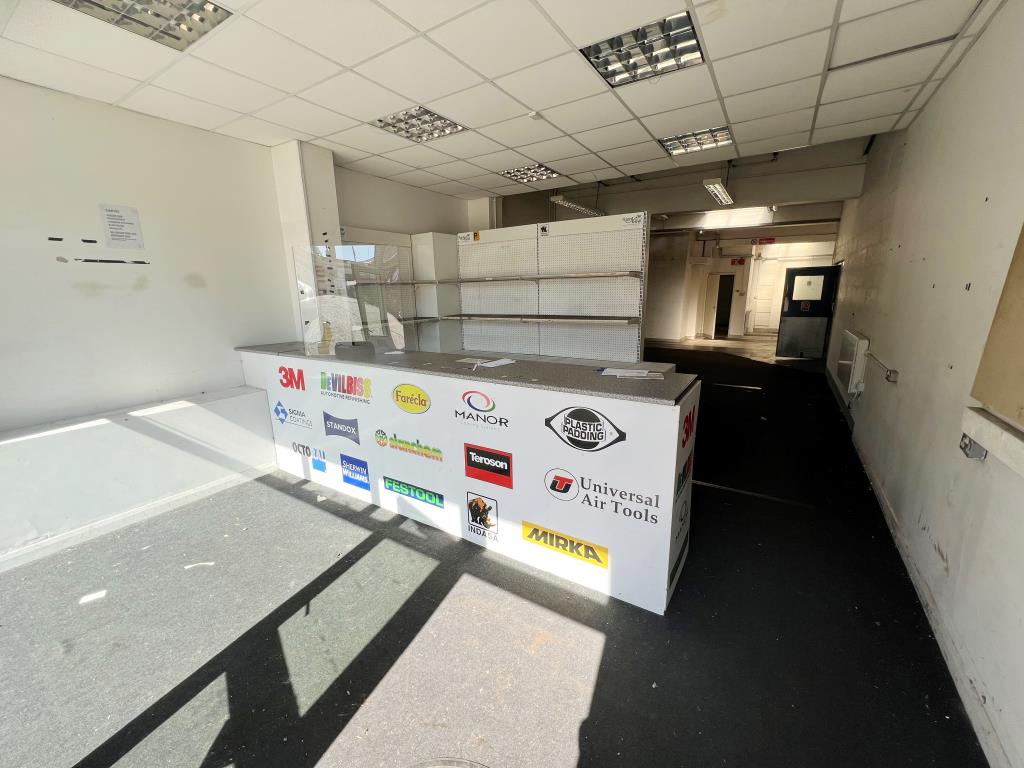 Lot: 83 - DECEPTIVE TOWN CENTRE COMMERCIAL BUILDING - Internal view, formerly customer service desk